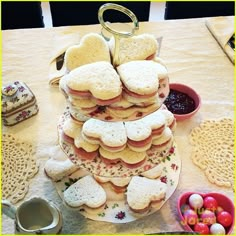 a tower of cookies and other treats on a table