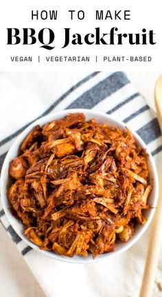 a white bowl filled with bbq jackfruit on top of a striped towel