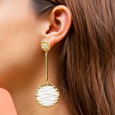 This beautiful and elegant earring is made out of a gold plated chain with hand-embroidered rings. The rings are made of small beads ("chaquira"). Its design is modern, minimalist and inspired by 'Huichol-Art'. It looks great both alone and combined with other  pieces of this collection! Features: * Material: Comes in gold-plated (14k)  * Packaging: All jewellery comes with a cloth bag for storing purposes Web: www.elramx.com Instagram: @elra_collection Email: elra.colle(at)gmail.com If you have White Beaded Chain Earrings, Elegant Adjustable Beaded Earrings With Beaded Chain, White Brass Drop Earrings, White Brass Dangle Jewelry, Elegant Adjustable Beaded Earrings, Chic White Gold Plated Jewelry, Modern White Brass Jewelry, Handmade Chic Gold Beaded Earrings, Elegant Beaded Chain Dangle Earrings