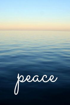 the word peace is written in white on top of water