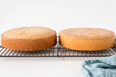 two cakes sitting on top of a cooling rack