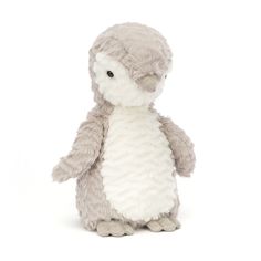 a gray and white stuffed penguin on a white background