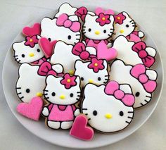 hello kitty cookies are arranged on a plate