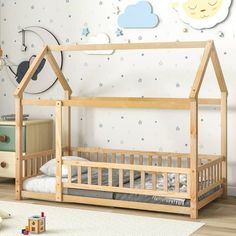 a child's bedroom with a wooden bed frame