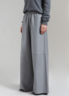 Color: Grey Midweight smooth leather Relaxed fit Wide leg Elasticated waistband Side seam hip pockets Slip-on style Unlined 100% Lamb Skin Dry Clean By The Frankie Shop. Made in India Fitted Leather Bottoms With Hip Pockets, Classic Leather Trousers, Leather Pants With Hip Pockets For Fall, Fitted Leather Wide-leg Pants, Full Length Leather Pants With Pockets, Modern Fitted Leather Bottoms, Fall Leather Bottoms With Hip Pockets, Leather Straight Leg Bottoms With Pockets, Straight Leg Leather Bottoms With Pockets