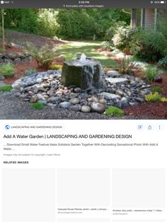 an image of a garden with rocks and water fountain in the center, surrounded by trees