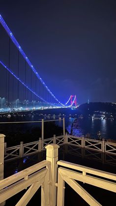 the bridge is lit up at night time