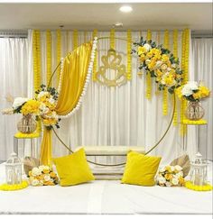 yellow and white wedding decor with flowers on the bed