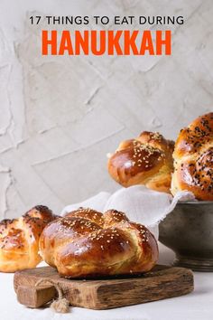 breads with sesame seeds on them and the words 17 things to eat during hanukkah