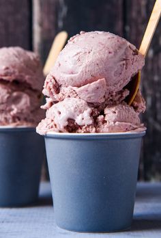 two cups filled with ice cream on top of a table