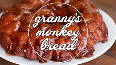 a white plate topped with monkey bread covered in caramel glaze and the words granny's monkey bread