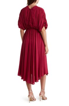 Slip into style with this puffed sleeve midi dress that exudes effortless attitude. 45" length (size S) V-neck Short puff sleeves Tied waistline 100% rayon Hand wash Imported Model stats: 5'10" height, 32" bust, 25" waist, 36" hip. Model is wearing size S. Chic Billowy Midi Dress With Bishop Sleeves, Flowy Midi Dress With Elastic Sleeves And V-neck, V-neck Midi Dress With Gathered Neckline For Brunch, Spring Midi Dress With Draped Puff Sleeves, Billowy Midi Dress With Balloon Sleeves For Fall, Spring Midi Dress With Puff Draped Sleeves, Fall Midi Dress With Billowy Balloon Sleeves, Fall Midi Dress With Balloon Sleeves, Bishop Sleeve Midi Dress For Brunch