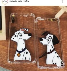 two phone cases with dalmatian dogs on them sitting next to each other,