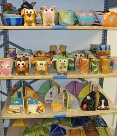 several shelves filled with ceramic owl figurines and other decorative items on wooden shelves