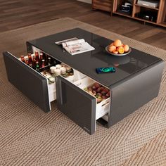 a coffee table with an open drawer in the middle