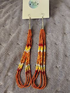 orange cream luster, red, orange and yellow seeded earrings 6" inch Orange Cream, Orange And Yellow, Dangling Earrings, Etsy Earrings Dangle, Labour Day, Jewelry Earrings Dangle, Dangle Drop Earrings, Seeds, Dangle Earrings