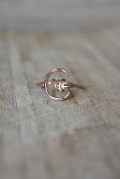 Rose Gold Moon Ring & Flawless Herkimer Diamond. Crescent moon and clear quartz crystal ring. This piece is a stunning rose gold fill with lightly hammered half moon. A lunar, celestial ring with a bright, clear Herkimer Diamond, a form of quartz crystal! The design is adjustable and cut from your size, so it also fits up to 10.0 if you like to wear rings on different fingers. The Herkimer crystal floats inside the crescent, but can move outside of it too. It's unique, feminine and sophistic Rose Gold Round Mystical Jewelry, Celestial Style Rose Gold Ring, Mystical Rose Gold Round Jewelry, Celestial Rose Gold Jewelry With Rose Cut Diamonds, Rose Gold Ethereal Gemstone Jewelry, Ethereal Rose Gold Jewelry For Anniversary, Rose Gold Moon Phase Jewelry For Wedding, Celestial Rose Gold Rings With Moon Phase, Celestial Rose Gold Gemstone Rings