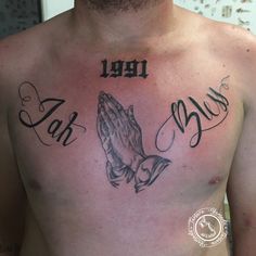 a man with a tattoo on his chest that has the words faith and an eagle