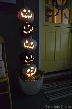 pumpkins are lit up in the shape of jack - o'- lanterns