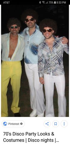 three men in white pants and blue shirts posing for the camera