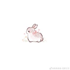 a white rabbit with pink hearts on its back