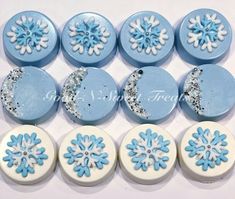 blue and white frosted buttons with snowflakes on the top one is letter c