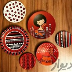 some red and white plates on a wooden table