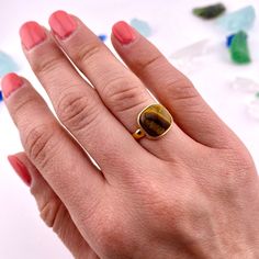 Adorn Yourself With Timeless Sophistication With Our Tiger's Eye Ring. Crafted With Luxurious Tiger Eye Gemstone, This Ring Exudes Elegance And Charm. Perfect For Adding A Touch Of Refinement To Any Outfit. Indulge In The Art Of Luxury With This Exquisite Piece. Ring Fits Sizes 4 Through 7 Made Of: Tiger's Eye 18k Gold Plating (7-10 Microns) Over Brass Made In Brazil Disclaimer: Please Note That All Semiprecious Stones Have Imperfections And Are Part Of Their Own Beauty. Due To Changes In Lighti Tiger Eye Gemstone, Tigers Eye Gemstone, Eye Ring, Ring Fit, Made In Brazil, Tiger's Eye, Adjustable Ring, Womens Jewelry Rings, Adjustable Rings