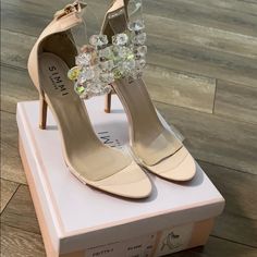 Brand New, Never Worn No Tags Product Code : Pritty-1 Nude Simmi London Spring Wedding Heels With Clear Strap, Spring Glamorous Heels With Clear Strap, Glamorous Spring Heels With Clear Strap, Glamorous Clear Heels For Spring, Clear Open Toe Heels For Events, Elegant Heels With Clear Strap For Spring, Elegant Heels With Clear Strap In Synthetic Material, Elegant Heels With Clear Strap, Spring Cocktail Heels With Clear Strap