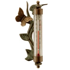 a thermometer with leaves and a butterfly on it