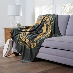 a couch with a blanket on top of it