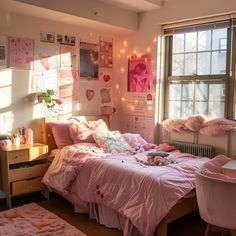 a bedroom with pink bedding and decorations