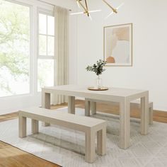 a white table and two benches in a room