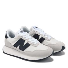 Taking retro cues the Women's New Balance 237 Retro Sneaker melds classic influences with a modern outlook. Mesh upper in a sneaker style with a round toe. Lace up front. New Balance N side logo. Padded collar and tongue. Mesh lining with a padded insole. EVA midsole. Rubber herringbone outsole. New Balance Shoes Black And White, Stylish Shoes For Women Casual, Nike New Balance Outfit, Women’s New Balance, New Balance Shoes 237, New Balance 237 Outfit, 237 New Balance, New Balance Sneakers Women, Black And White New Balance