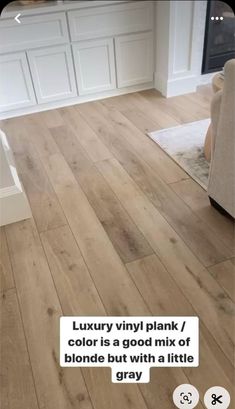 a living room with wood flooring and white walls, text reads luxury vinyl plank / color is a good mix of blonde but with a little gray