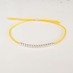 Minimalist, wearable and delicate silver multicolor thread bracelet available in several colors. Length: 20cm adjustable knot. Width: 2mm. Fully adjustable, Handmade in Spain. More colors available in this product => https://www.etsy.com/listing/845364478/tiny-simple-cord-sterling-silver-wish Ideal for a gift and for combinate with other bracelets. All our products are presented in a white organza bag. ♡ Made with love in Valencia ♡ ----------------------------- Discover the NICTE bracelets c Minimalist Adjustable Friendship Bracelets, Sterling Silver Friendship Bracelet With Sliding Knot, Sterling Silver Adjustable Friendship Bracelets, Everyday Adjustable Sterling Silver Friendship Bracelets, Minimalist Silver Friendship Bracelets With Tiny Beads, Minimalist Silver Friendship Bracelet With Tiny Beads, Minimalist Handmade Friendship Bracelets, Silver Friendship Bracelets With Adjustable Round Beads, Adjustable Minimalist Friendship Bracelet