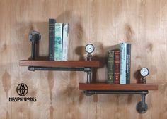 two shelves with books and clocks on them