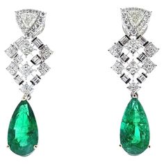 A pair of fashion earrings featuring a pear-shaped emerald as the main stone, with a substantial weight of 8.24 carats. The emerald exhibits a green color, which is a characteristic and highly desirable feature in emeralds. The setting for these earrings is made of 18k white gold, providing a classic and elegant look. Luxury Pear-shaped Emerald Earrings, Formal Pear-shaped Emerald Earrings, Emerald Fashion, Green Emerald, Pear Shape, Pear Shaped, Emerald Green, Green Color, Fashion Earrings