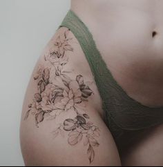 a woman's stomach with flowers on it