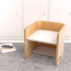 a white table and some books on the floor