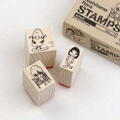 three rubber stamps sitting on top of each other in front of a box with stampers