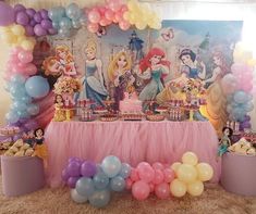 a birthday party with princesses and balloons