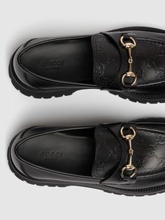 Black leather . Silver-toned hardware. Black GG leather insert . Horsebit . Rubber lug sole . Flat Luxury Black Loafers With Leather Footbed, Luxury Loafers With Studded Rubber Outsoles, Gucci Black Leather Loafers, Luxury Black Gucci Loafers, Black Calf Leather Loafers With Horsebit Detail, Ski Accessories, Loafer Mules, Mule Sandals, Sports Accessories