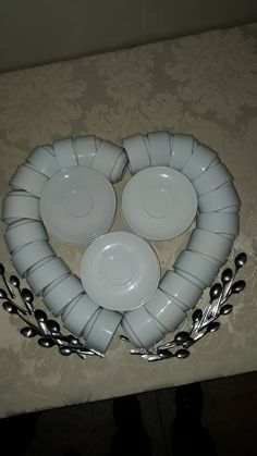 three plates in the shape of a heart on a table