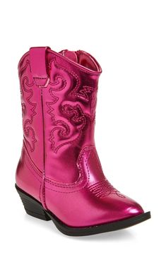 a child's pink cowboy boot on a white background