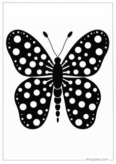 a black and white butterfly with polka dots