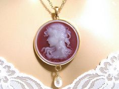 Cherry Red Cameo Necklace: Victorian Woman Round Cameo Necklace, Vintage Inspired Victorian Jewelry Cherry Red Background, Woman And Flowers, Vintage Chanel Jewelry, Unique Jewelry Vintage, Victorian Accessories, Art Deco Jewelry Vintage, Victorian Cameo, Rare Jewelry, Sarah Coventry Jewelry