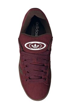 Serrated 3-Stripes and matching Trefoils stand out on this suede sneaker featuring extrasoft cushioning on the tongue and cuff for a skate-inspired twist. Lace-up style Textile and leather or leather upper/textile lining/rubber sole Imported Adidas Campus 00s, The Tongue, Adidas Campus, Sneaker Men, Red Dark, Suede Sneakers, Up Styles, Rubber Sole, Dark Brown