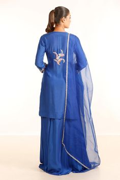 Electric blue kurta with placement embroidery in floral pattern. Paired with a palazzo and dupatta.
Components: 3
Pattern: Embroidery
Type Of Work: Floral
Neckline: Tear Drop Neck
Sleeve Type: Full Sleeves
Fabric: Silk Muslin And Organza 
Color: Blue
Other Details: 
Length:
Kurta: 38 inches
Palazzo: 40 inches
Closure: Side zip
Occasion: Sangeet - Aza Fashions Silk Sets With Floral Embroidery For Reception, Transitional Raw Silk Sets With Floral Embroidery, Transitional Floral Embroidery Sets In Raw Silk, Blue Cotton Silk Dupatta For Reception, Blue Slub Silk Kurta With Sheer Dupatta, Elegant Art Silk Sharara With Floral Embroidery, Embroidered Silk Palazzo Set, Fitted Silk Embroidered Palazzo Set, Embroidered Fitted Silk Palazzo Set