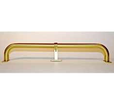 a gold metal rail on a white background